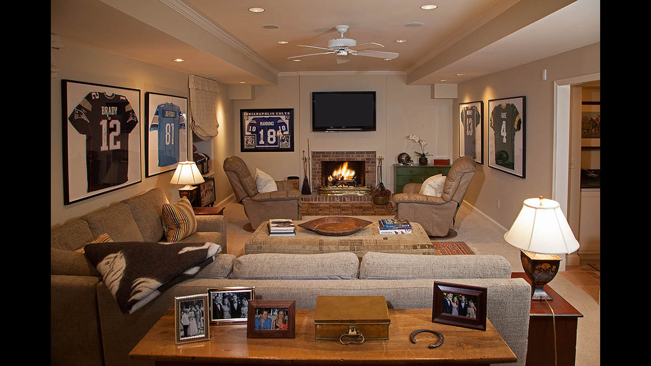 A living room with couches and a fireplace.
