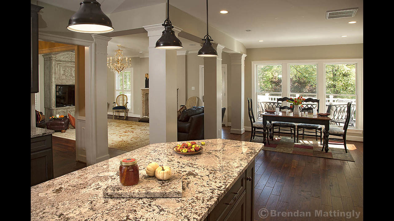 A kitchen with a granite counter top.