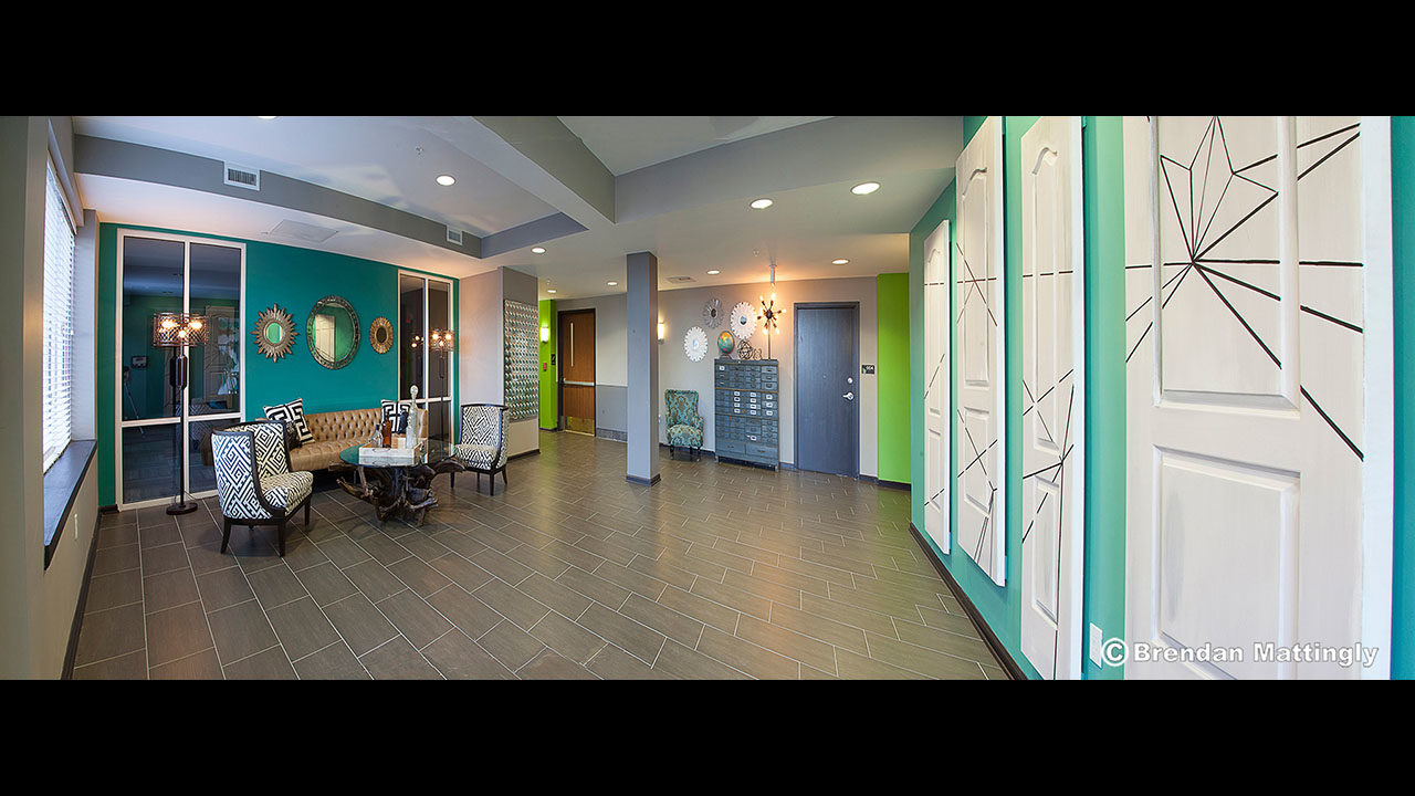 The lobby of a dental office is decorated in bright colors.