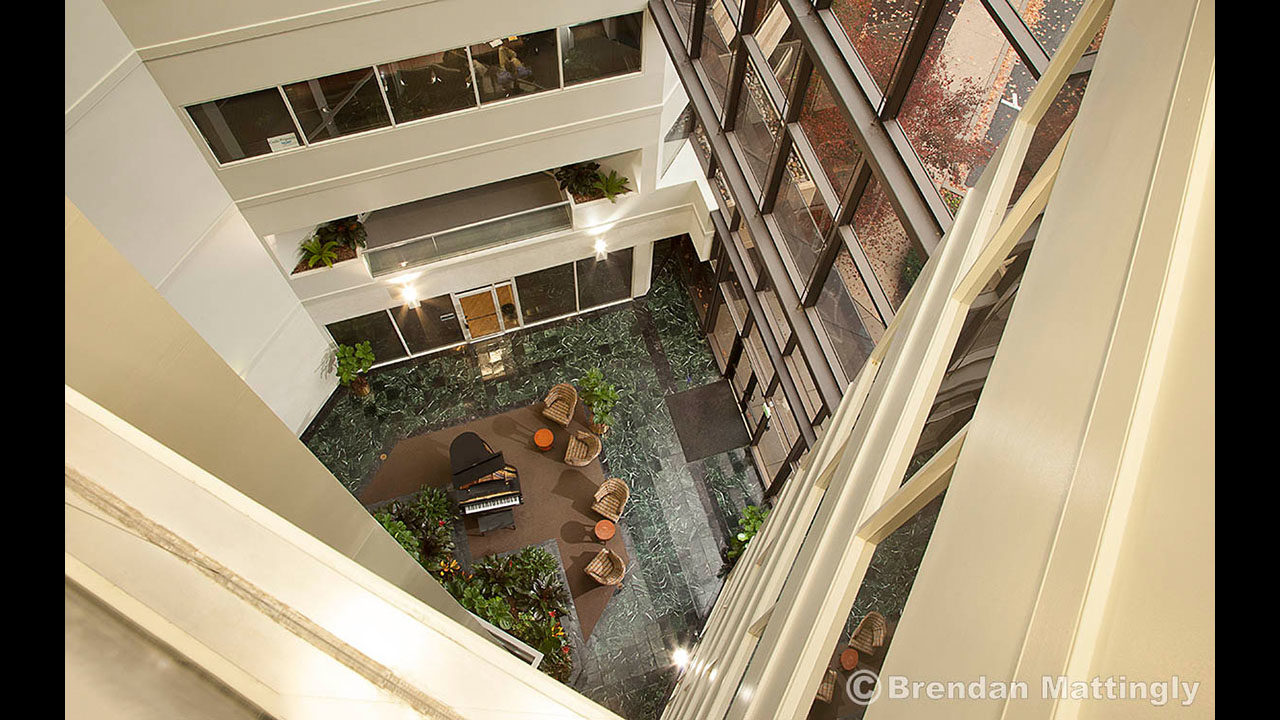 A view from the top of an atrium in an office building.