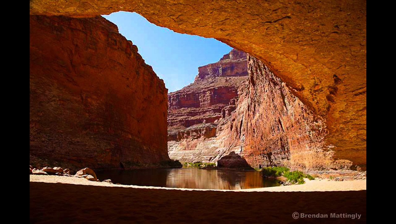 A view of the grand canyon from the inside of a cave.