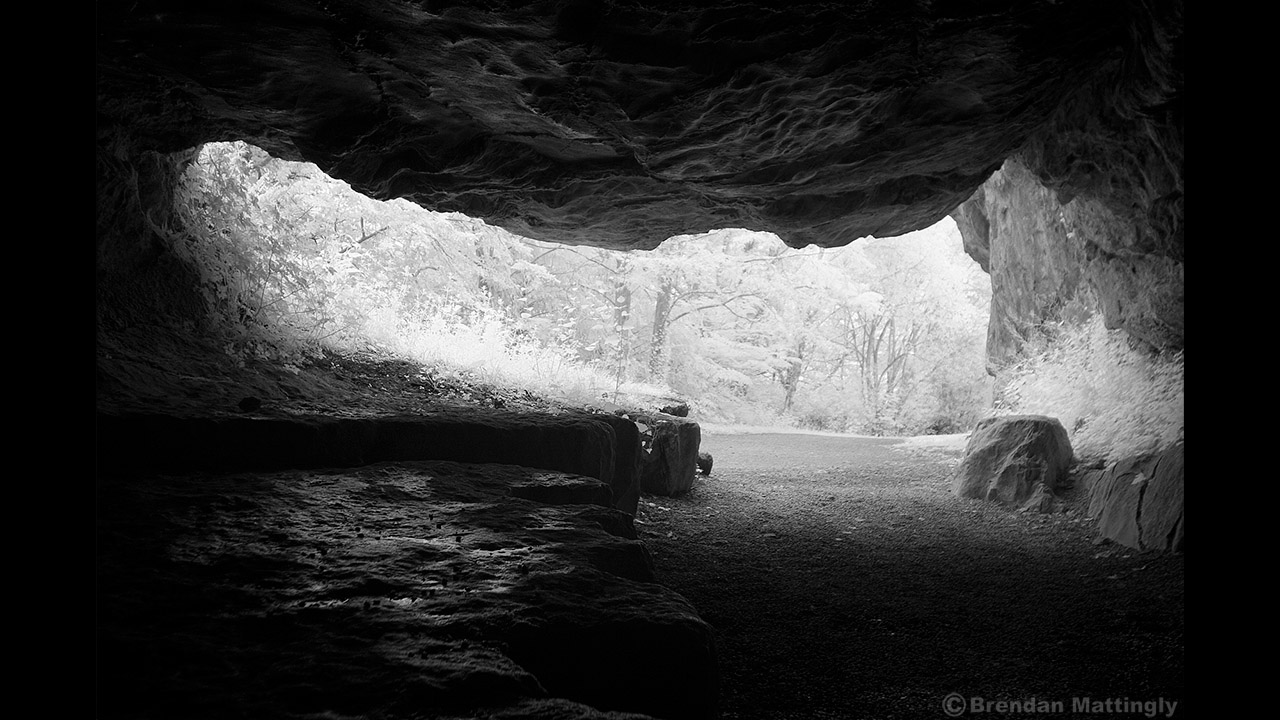 A black and white photo of a cave.