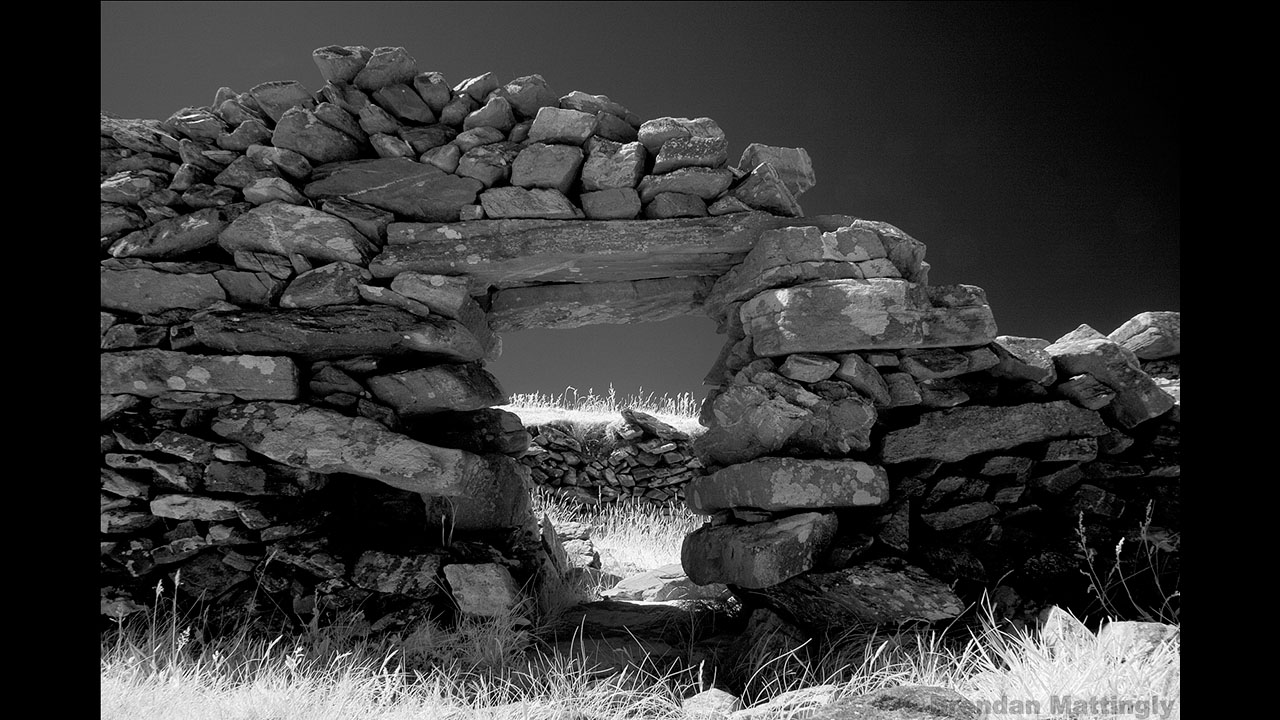 A black and white photo of a stone wall.
